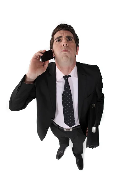 Businessman taking a bad phone call — Stock Photo, Image