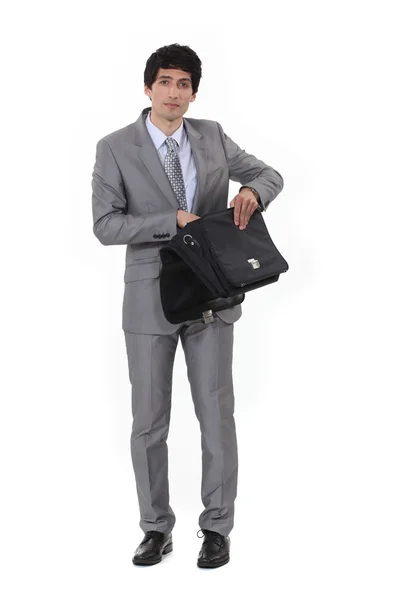 Businessman routing through bag — Stock Photo, Image