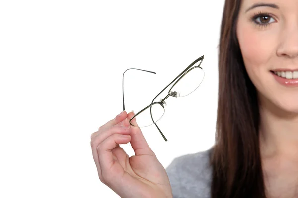 Teenage brunette removing glasses — Stock Photo, Image