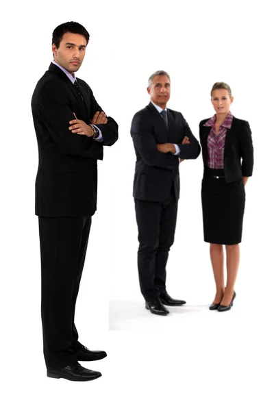 Three businesspeople stood together — Stock Photo, Image