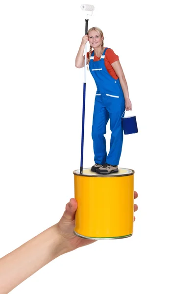 Decorator standing on paint pot — Stock Photo, Image