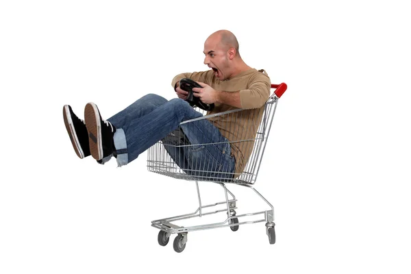 Man pretending to drive trolley — Stock Photo, Image