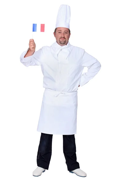 Chef holding French flag isolated on white — Stock Photo, Image