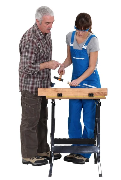 Carpenter training young female apprentice — Stock Photo, Image