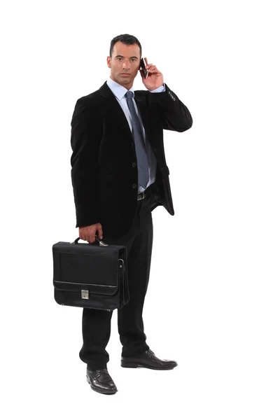 Serious businessmen with a cellphone — Stock Photo, Image