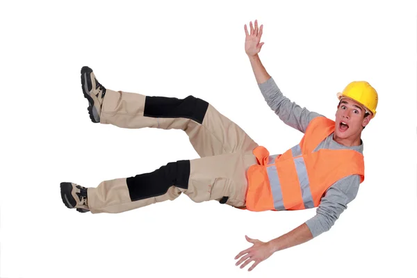 Builder falling through the air — Stock Photo, Image