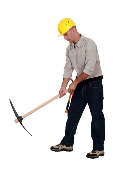 Laborer using a pickaxe — Stock Photo, Image