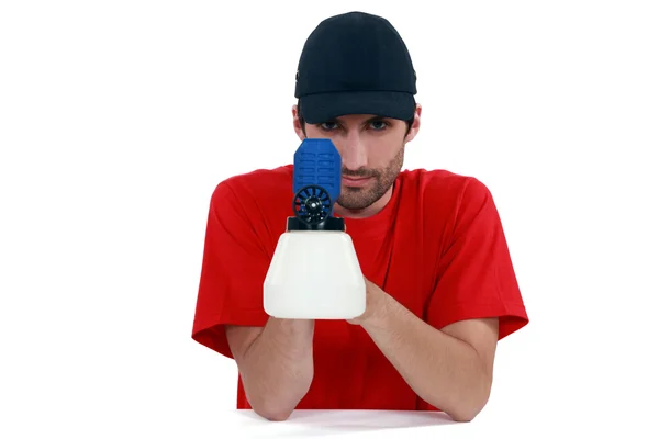 Tradesman holding a spray gun — Stock Photo, Image