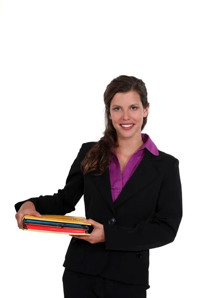 Brunette holding files — Stock Photo, Image