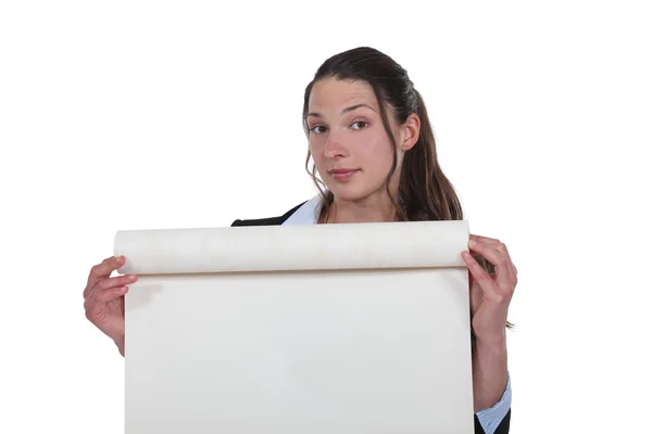 Woman unrolling a roll of paper — Stock Photo, Image