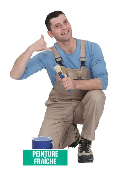 Decorator making telephone gesture — Stock Photo, Image