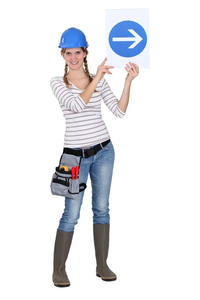 Builder holding traffic sign — Stock Photo, Image