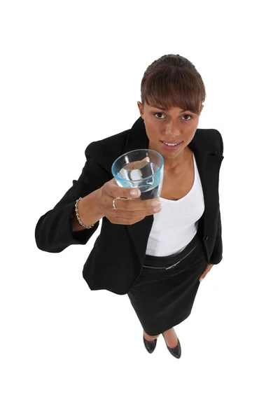 Businesswoman holding glass of water — Stock Photo, Image