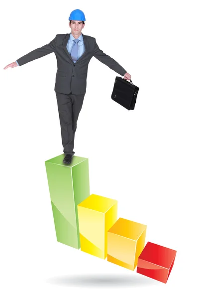 Architect balancing on bar chart — Stock Photo, Image