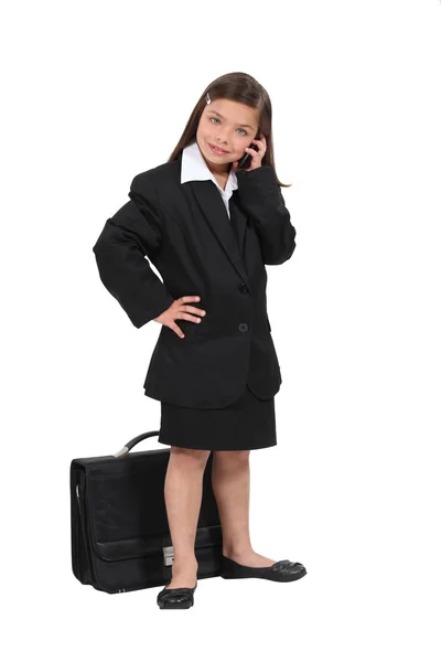 Little girl dressed as a businesswoman — Stock Photo, Image