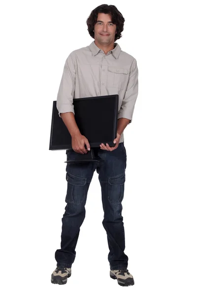 Computer technician holding monitor — Stock Photo, Image