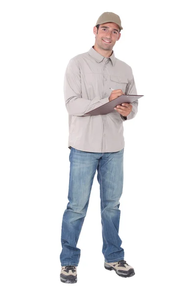 Delivery man with a clipboard — Stock Photo, Image