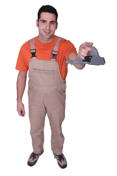 Handyman segurando ferramenta — Fotografia de Stock