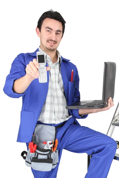 Plumber with computer showing phone — Stock Photo, Image