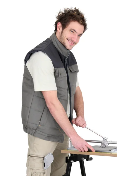 Man with a tile cutter — Stock Photo, Image