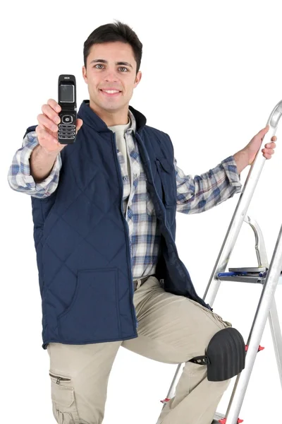 Tiler holding a cell phone — Stock fotografie