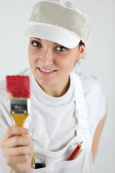 Female decorator holding paint brush — Stock Photo, Image
