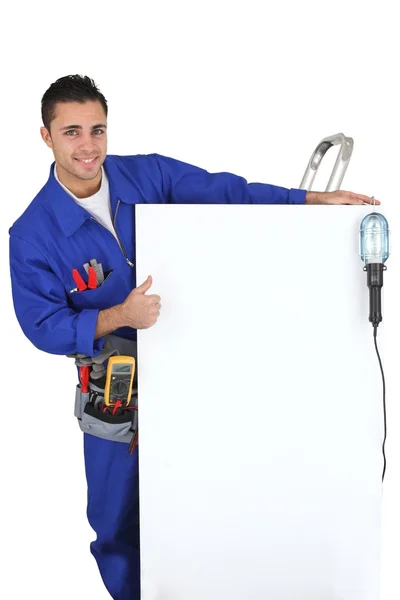 Electrician showing a panel — Stock Photo, Image