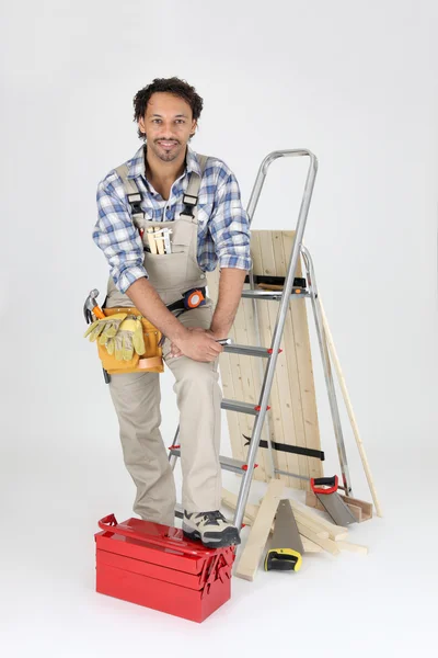Carpenter with equipment, studio shot — Stock Photo, Image