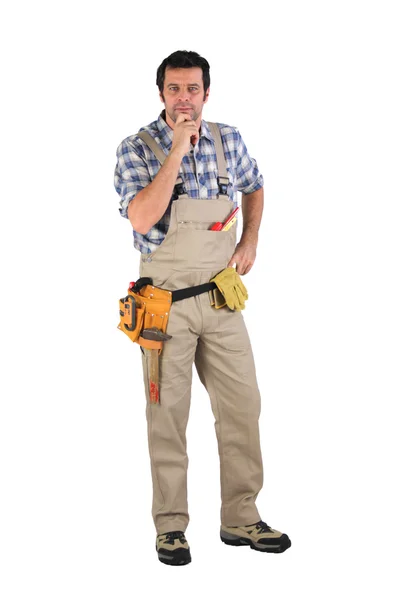 Craftsman holding his chin — Stock Photo, Image