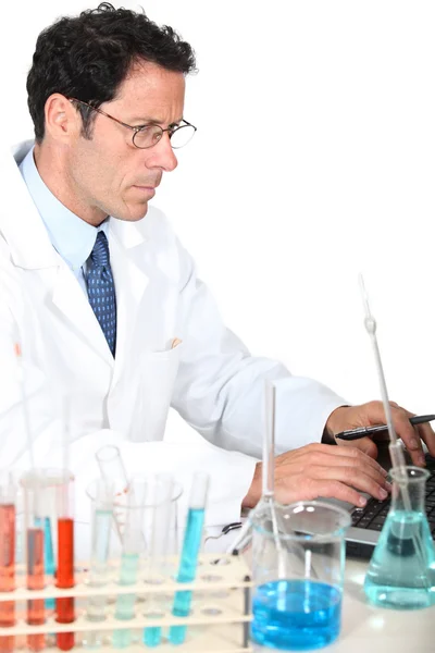 Lab technician entering data — Stock Photo, Image