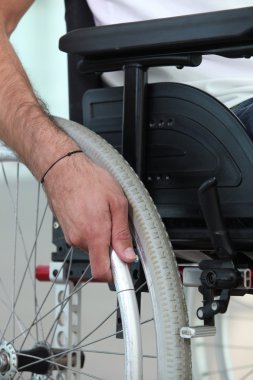 Disabled person confined to a wheelchair clipart