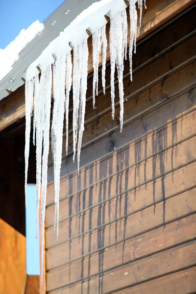 Stalactite hanging from chalet roof — Stock Photo, Image