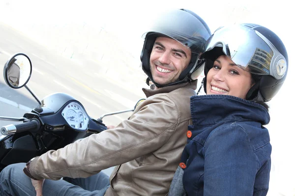 Couple on a scooter — Stock Photo, Image