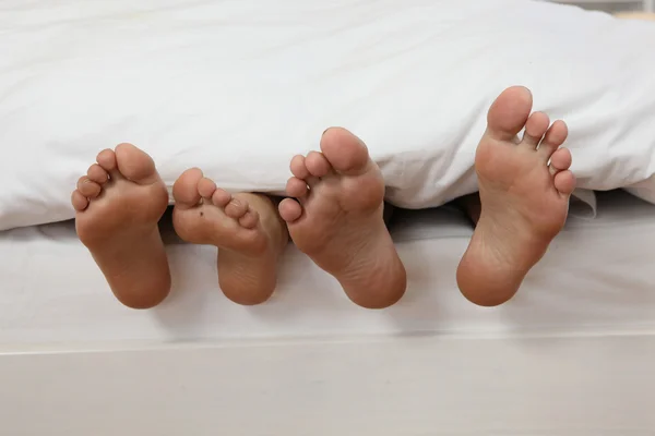 Couple laid in bed — Stock Photo, Image