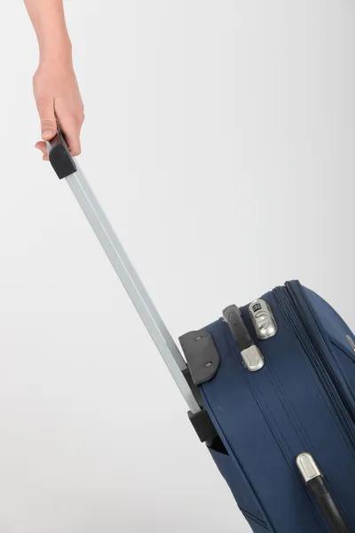 Suitcase being pulled along — Stock Photo, Image