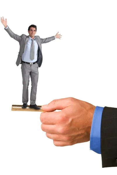 Businessman balancing on a giant credit card — Stock Photo, Image