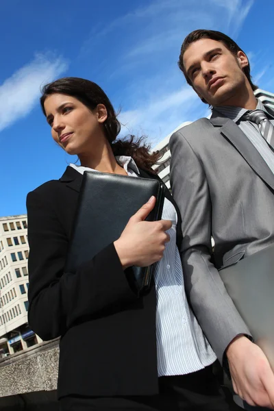 Business couple with a diary — Stockfoto