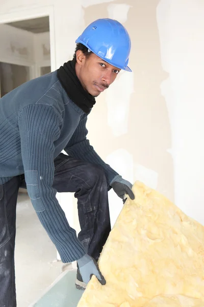 Worker handling insulation — Stock Photo, Image