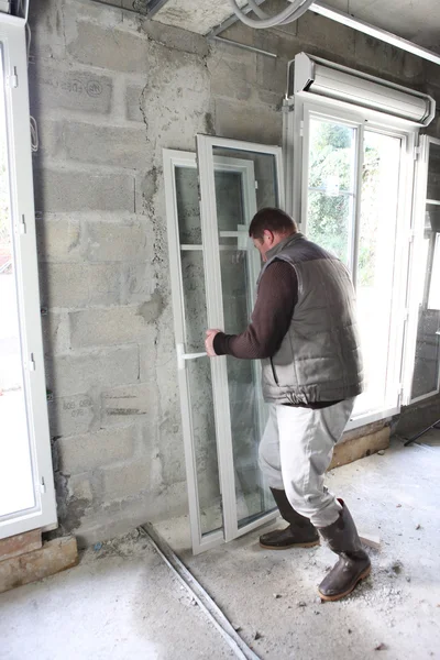 Worker installing new windows — Stock Photo, Image