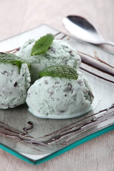 Three scoops of ice-cream on a plate. — Stock Photo, Image