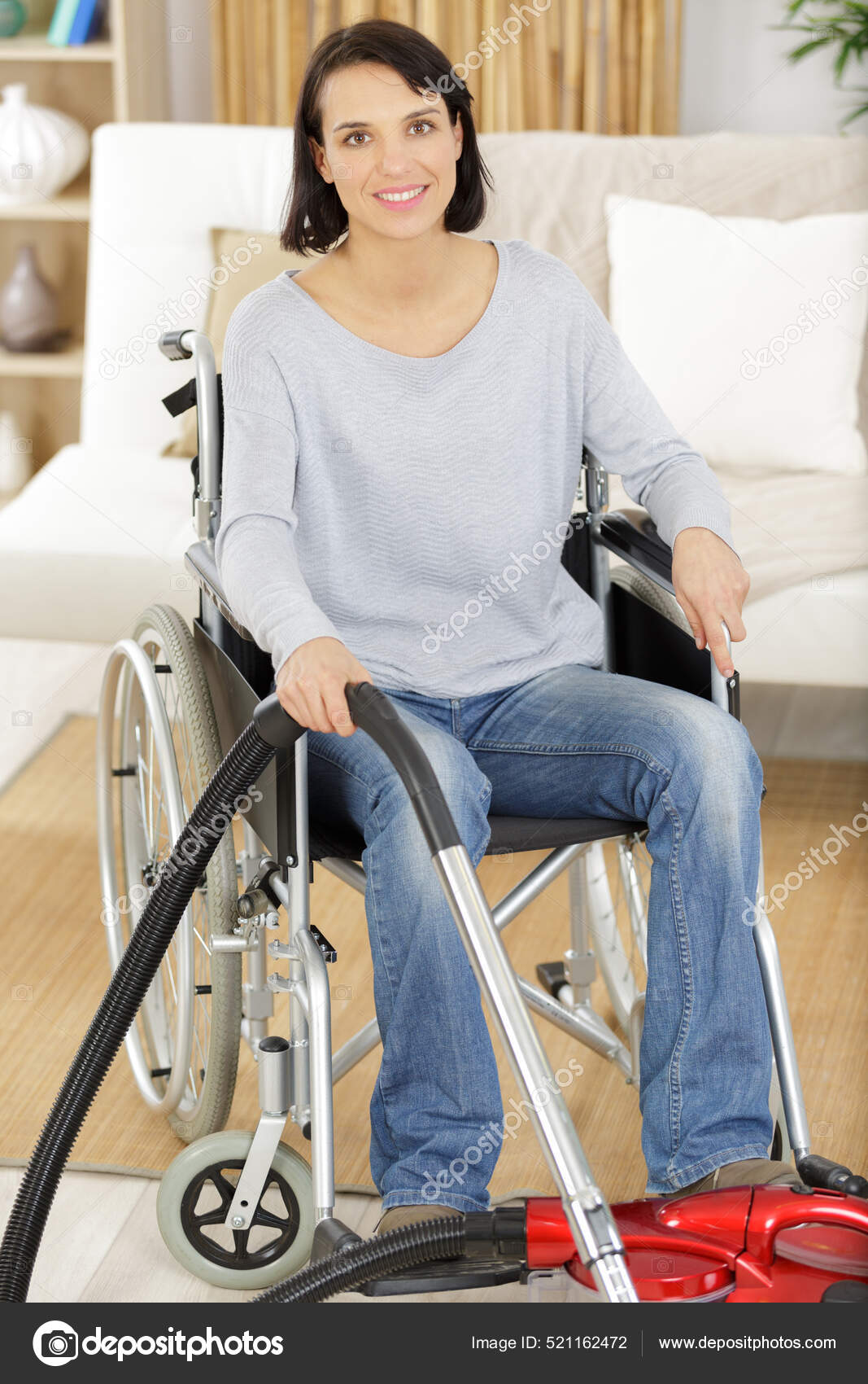 Disabled Woman Using Vacuum Cleaner Stock Photo by ©photography33 521162472