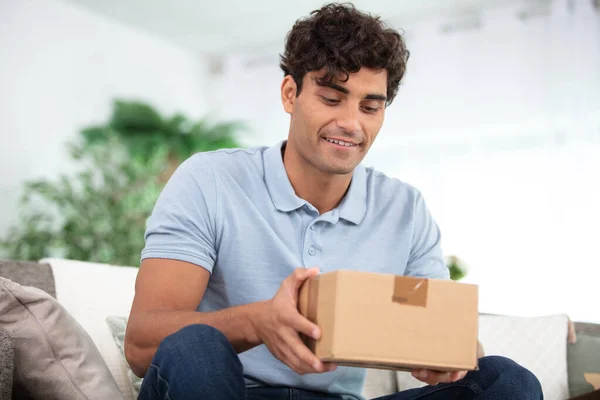 Young Man Sitting Sofa Parcel — Stock Photo, Image