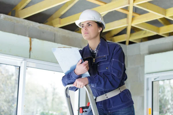 Woman Checking Document Repairing Apartment — Stock Photo, Image