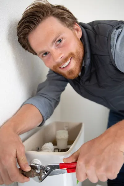 Plumber Repairing Toilet Tank Restroom — Stock Photo, Image