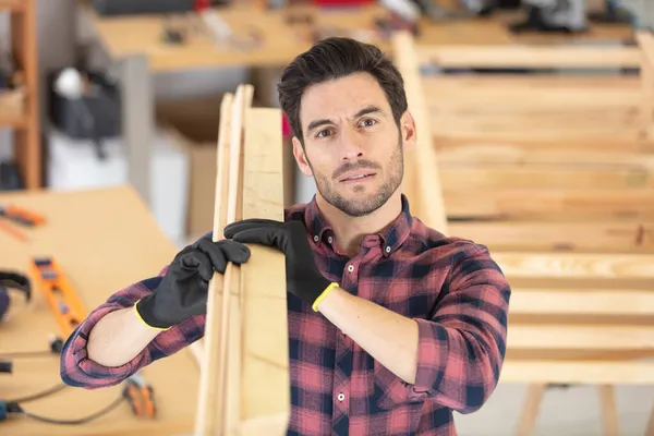 Smiling Mature Carpenter Carrying Wooden Planks His Shoulder — Stock Photo, Image