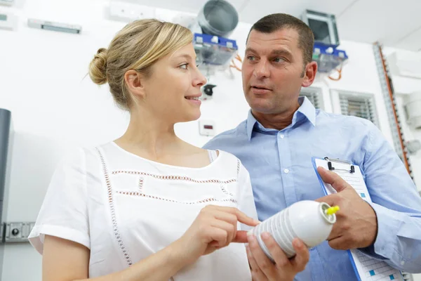 Woman Holding Small Pressurized Container — Stock Photo, Image