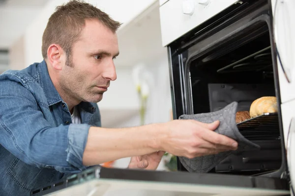 Man Taking Tray Baked Croissants Oven — Stock Photo, Image