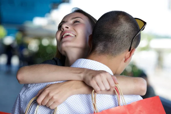 Happy Girlfriend Hugging Partner Shopping Treat — Foto Stock
