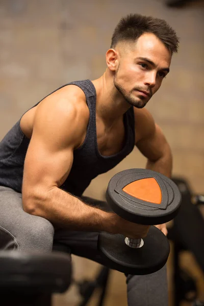 Young Guy Carrying Dumbbell — Stockfoto