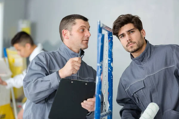 Workshop Supervisor Giving Instruction Male Painter — 스톡 사진